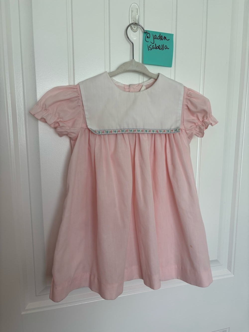 Pink Baby Dress with White Bib and Embroidered Trim